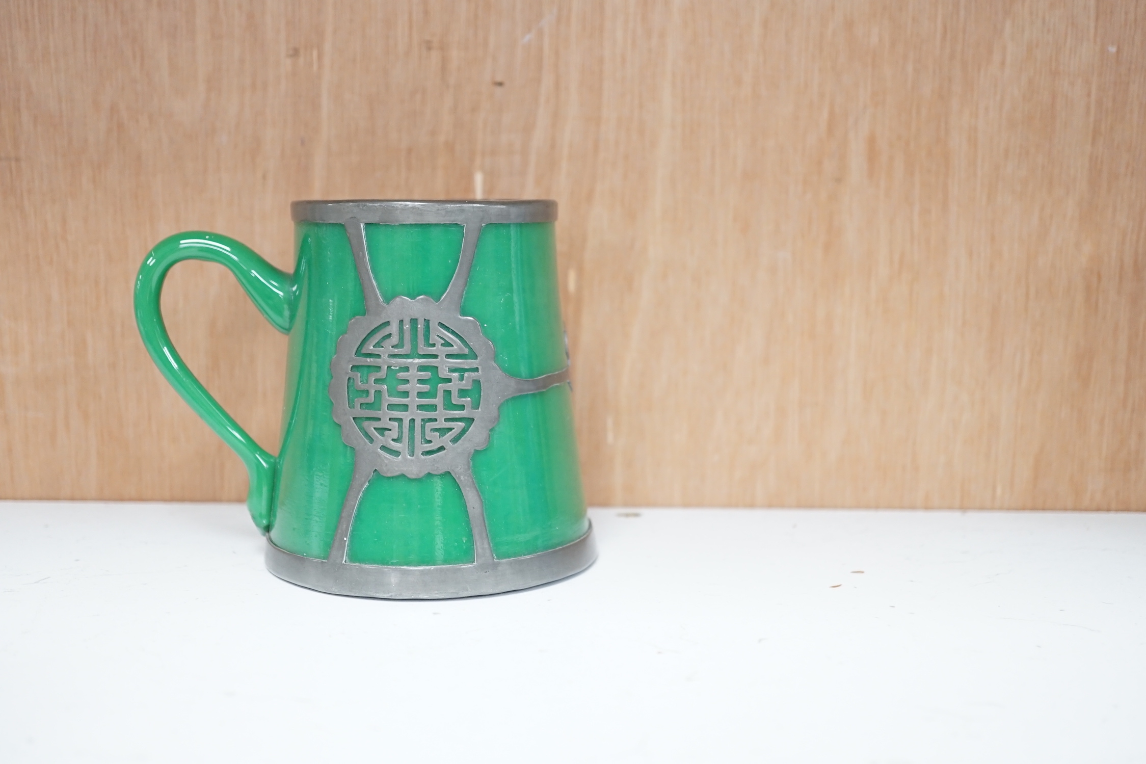 A Japanese blue and white pot coffee set and a 19th century blue and white cheese dish and a Chinese green glass and pewter mounted mug
